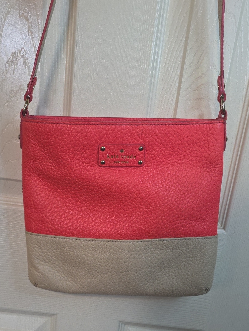 kate spade Coral Red and Beige Two-Tone Pebbled Leather Crossbody.